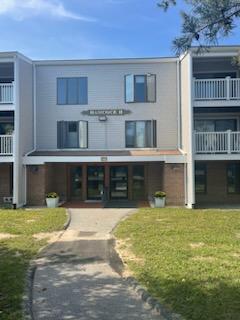 42 Old Colony Way, Unit 1 Orleans, MA 02653 - Photo 1 of 16 a view of a house with a swimming pool