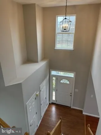 a view of an entryway with wooden floor