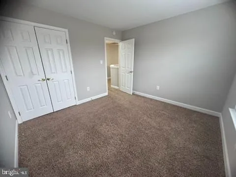 a view of an empty room and a window