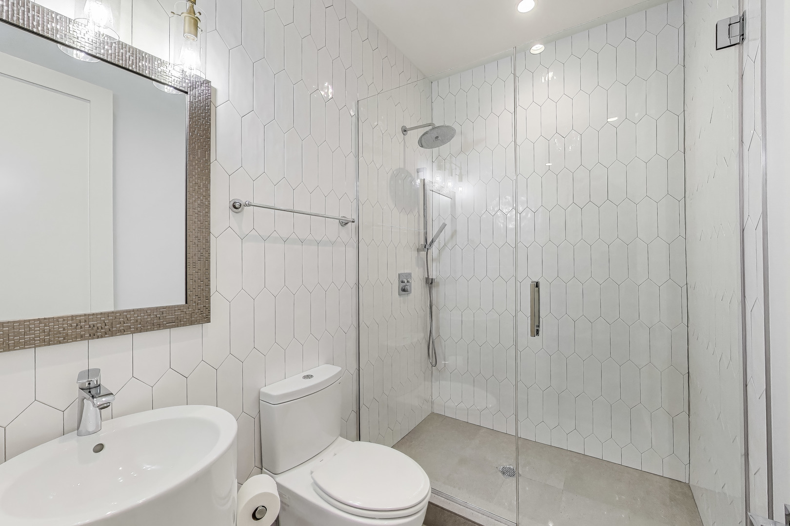 1474 West Ohio Street, Unit 1 Chicago, IL 60642 - Photo 16 of 37 a bathroom with a toilet sink shower and mirror