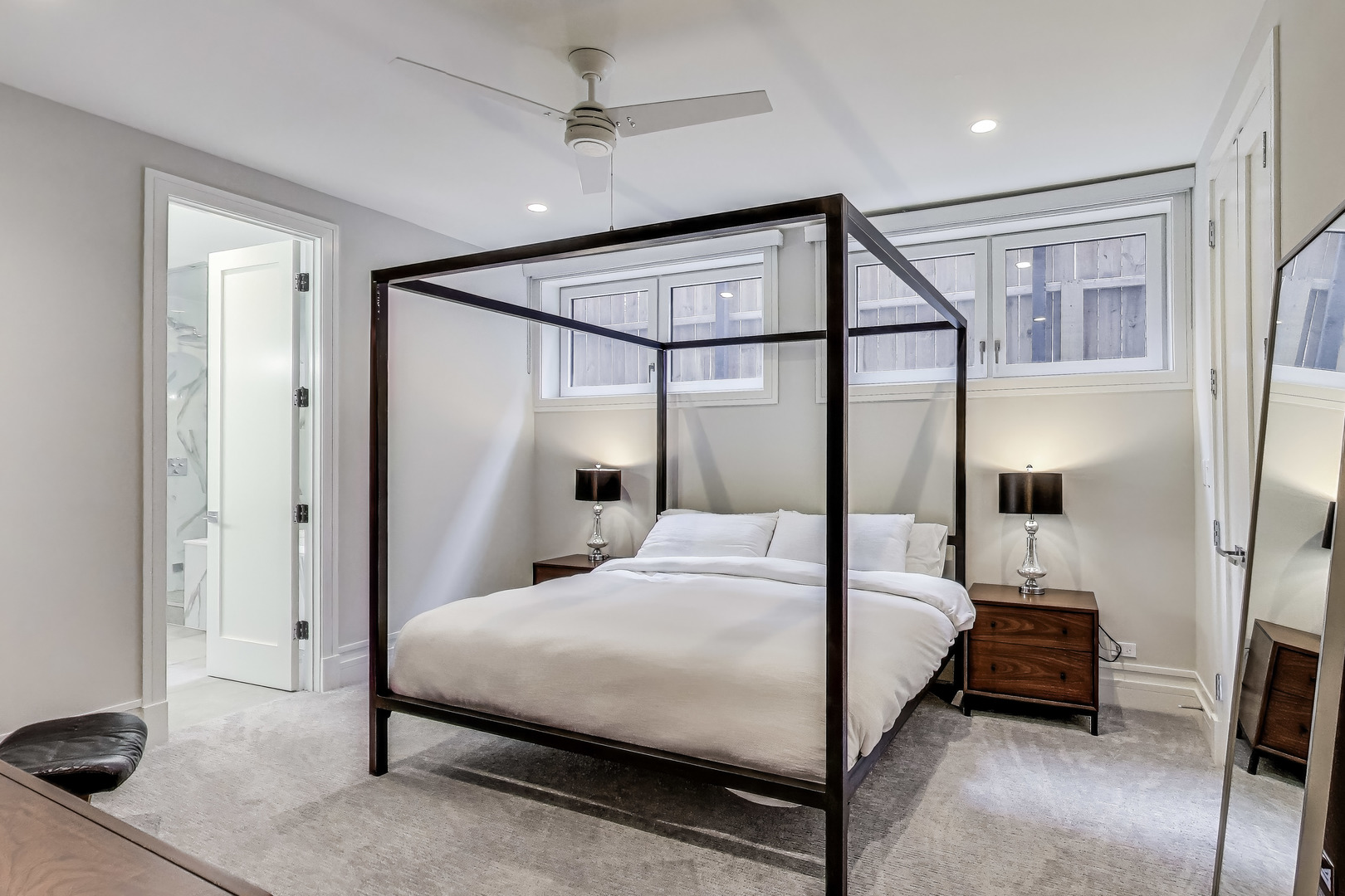 1474 West Ohio Street, Unit 1 Chicago, IL 60642 - Photo 17 of 37 a bedroom with a bed mirror and a balcony