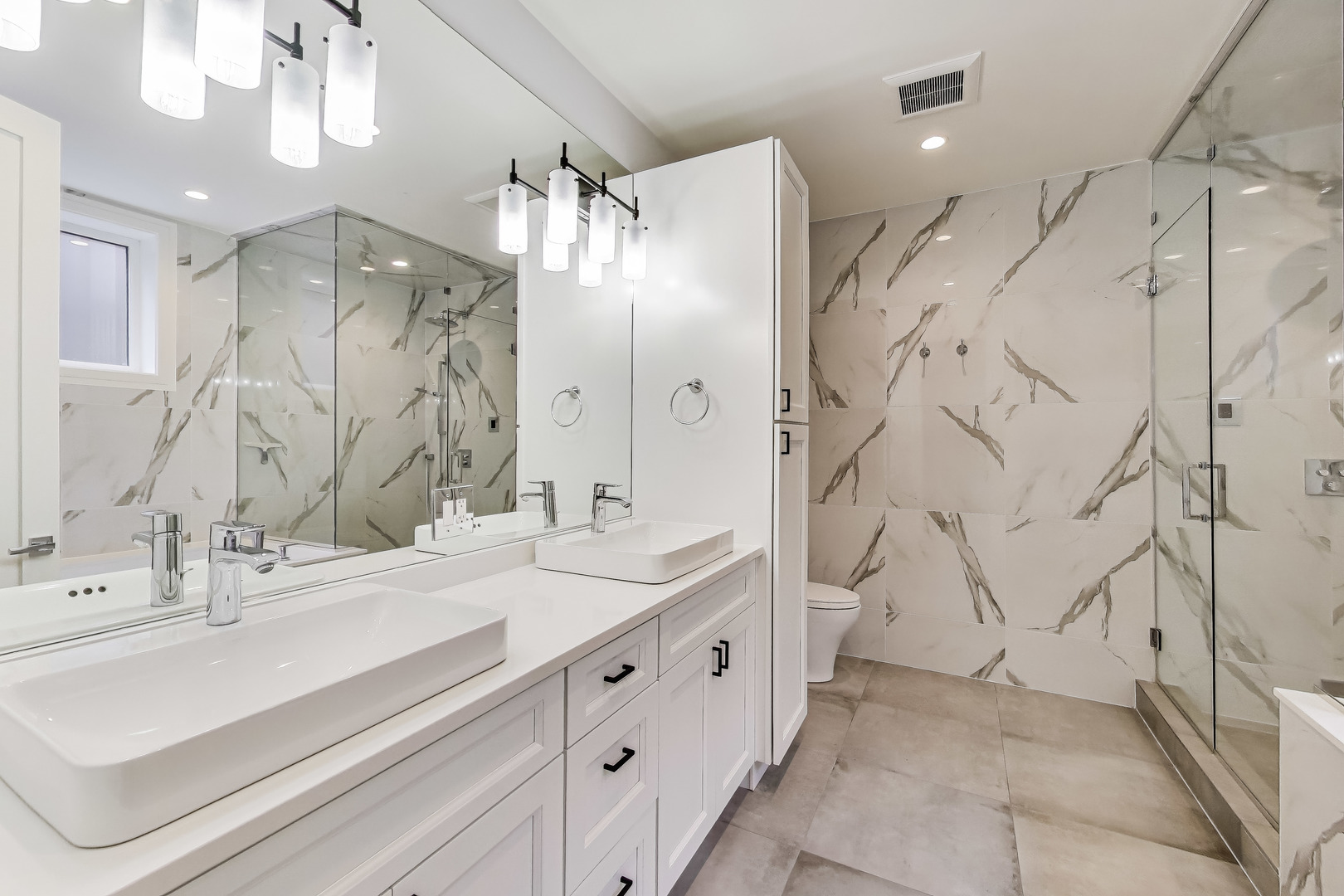 1474 West Ohio Street, Unit 1 Chicago, IL 60642 - Photo 20 of 37 a bathroom with a double vanity sink mirror and shower