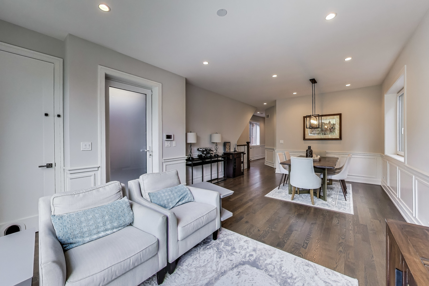 1474 West Ohio Street, Unit 1 Chicago, IL 60642 - Photo 2 of 37 a living room with furniture and wooden floor