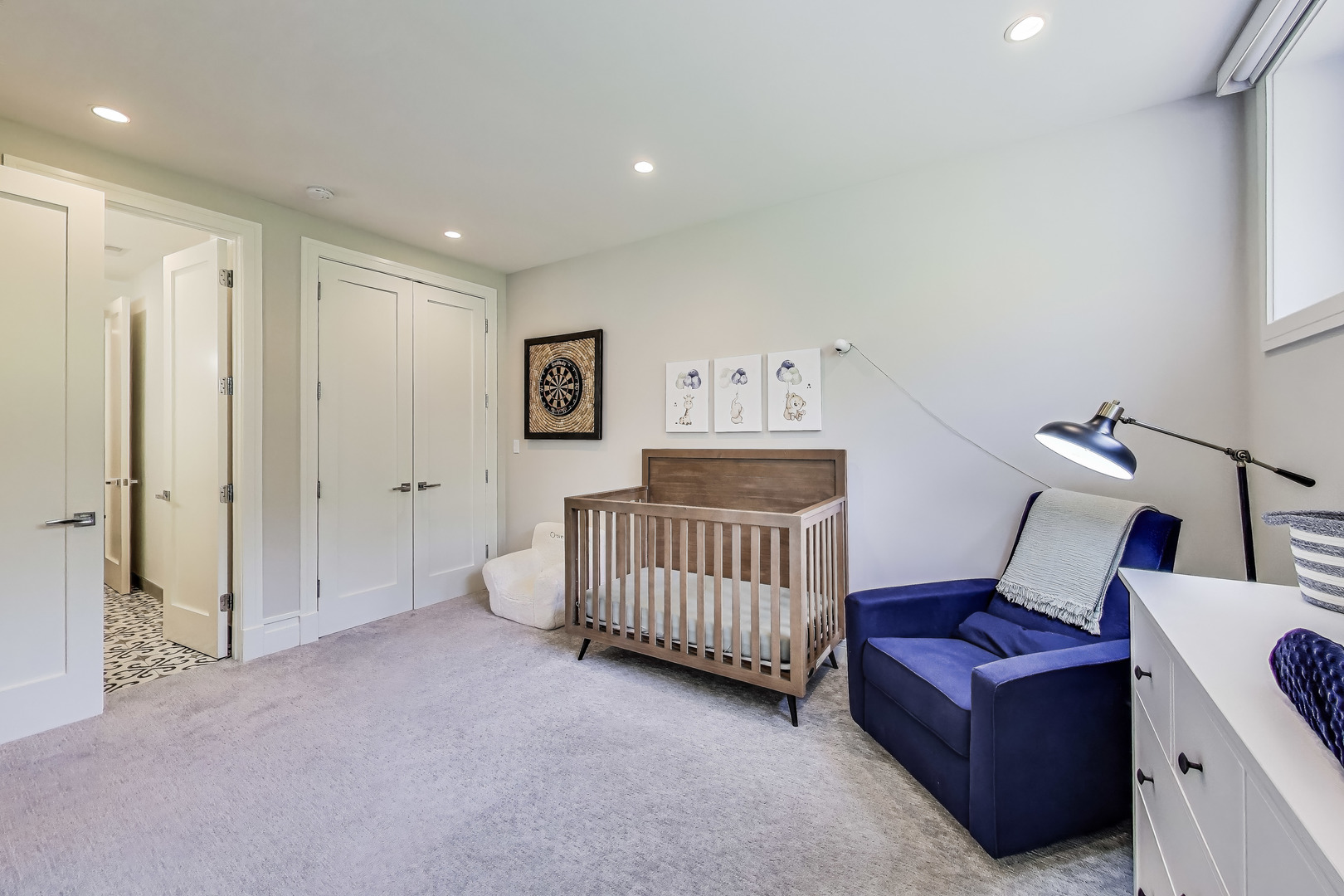1474 West Ohio Street, Unit 1 Chicago, IL 60642 - Photo 23 of 37 a living room with furniture and a baby crib