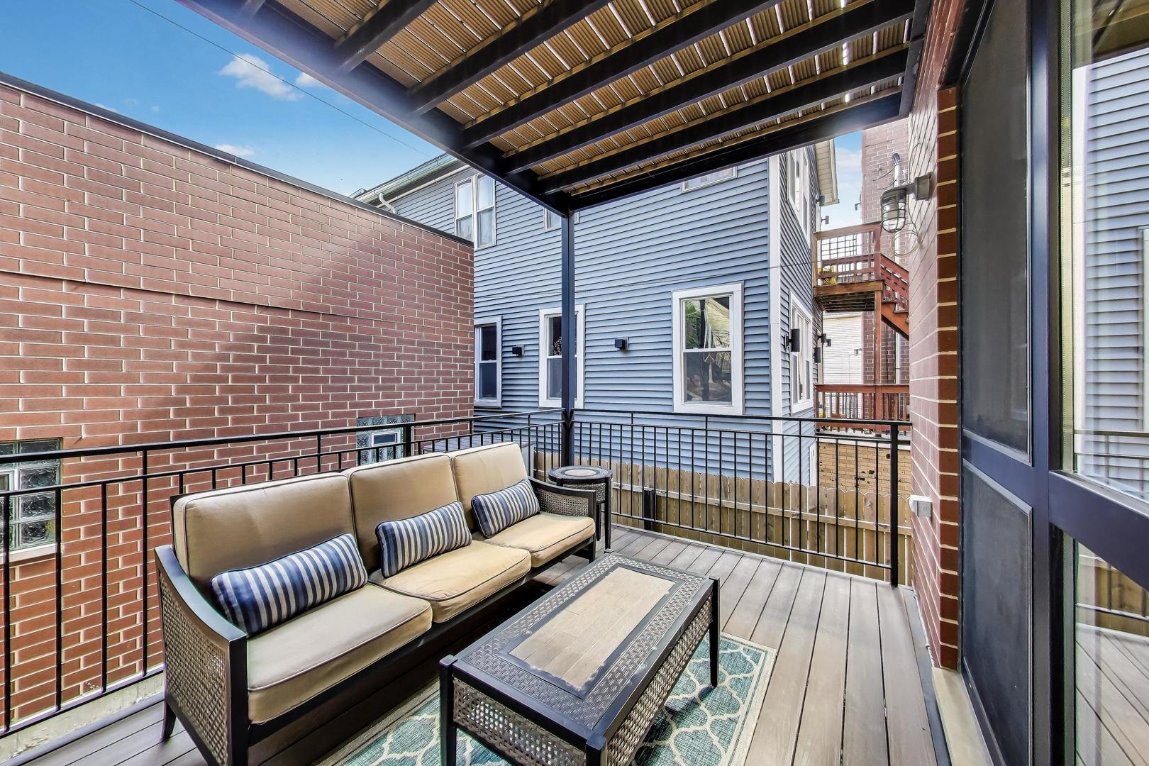 1474 West Ohio Street, Unit 1 Chicago, IL 60642 - Photo 30 of 37 a outdoor living space with patio furniture