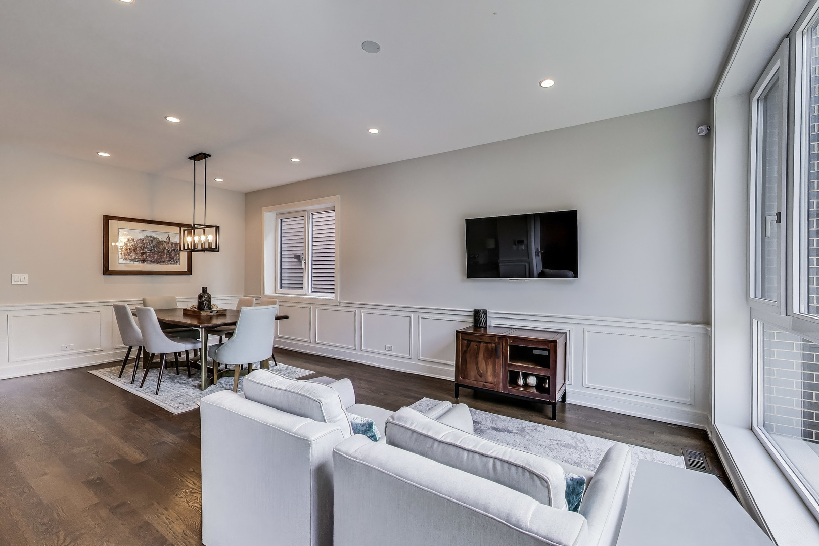 1474 West Ohio Street, Unit 1 Chicago, IL 60642 - Photo 4 of 37 a living room with furniture a fireplace and a flat screen tv