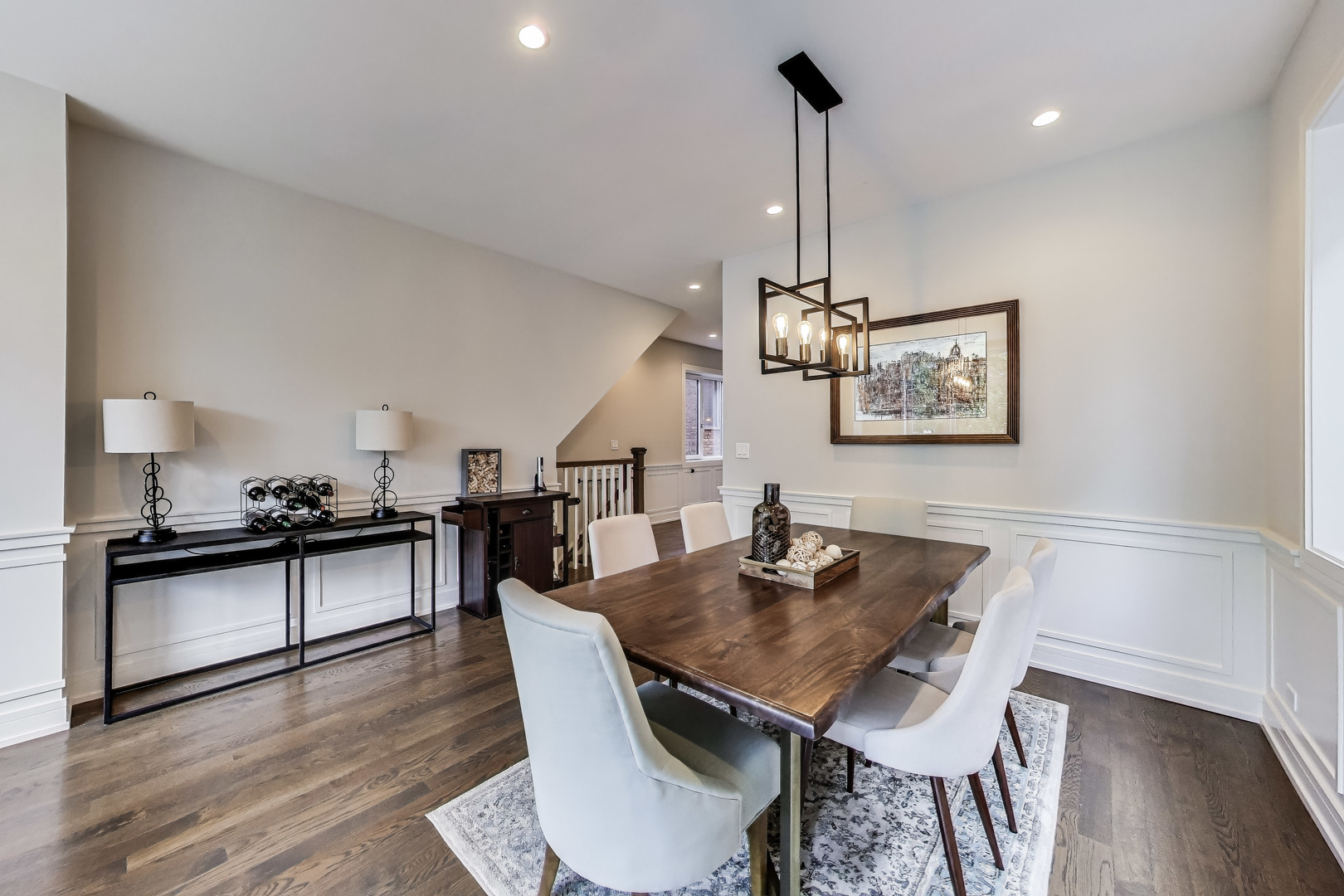 1474 West Ohio Street, Unit 1 Chicago, IL 60642 - Photo 6 of 37 a dining room with furniture a chandelier and wooden floor