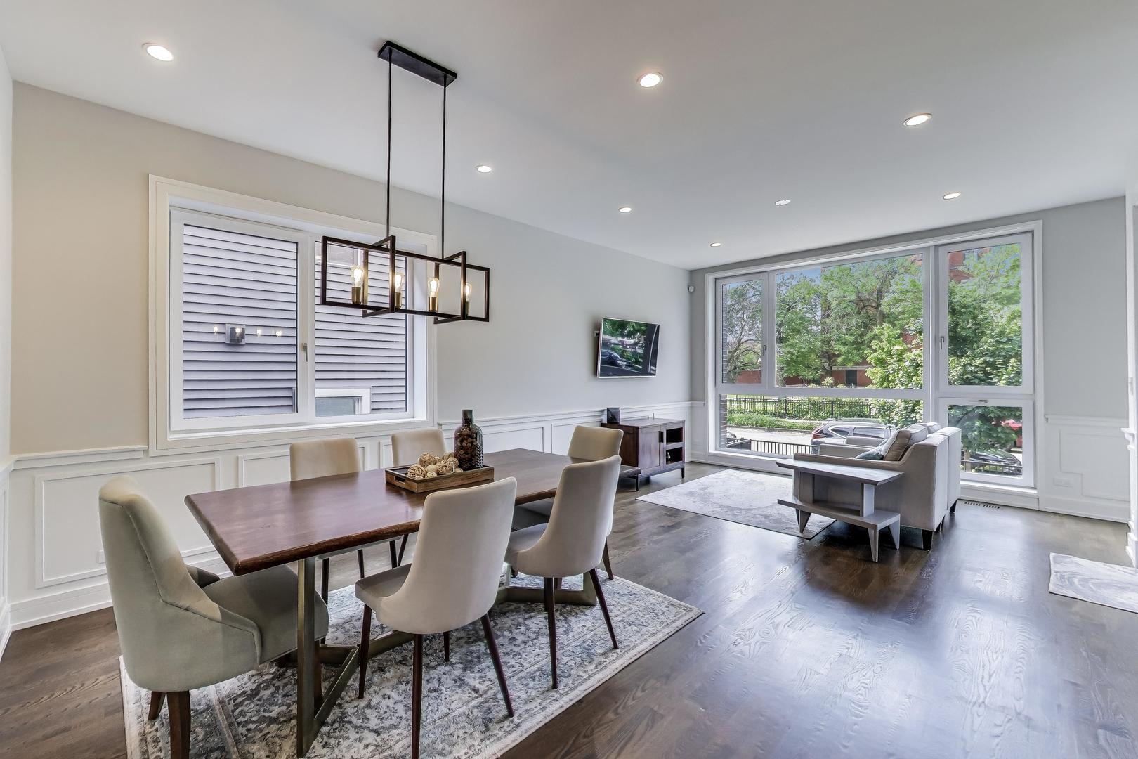 1474 West Ohio Street, Unit 1 Chicago, IL 60642 - Photo 7 of 37 a view of a dining room with furniture window and wooden floor