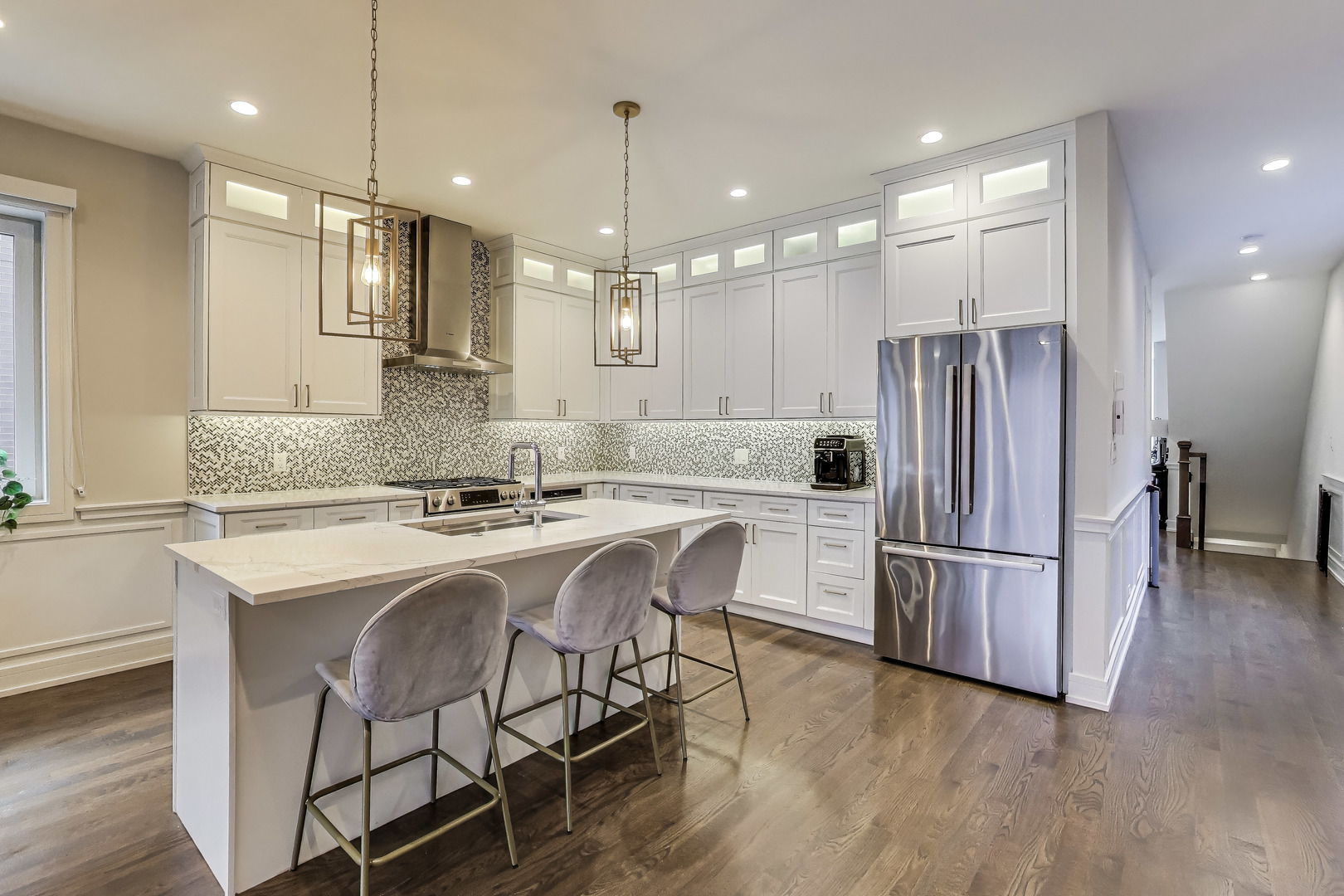 1474 West Ohio Street, Unit 1 Chicago, IL 60642 - Photo 9 of 37 a kitchen with stainless steel appliances granite countertop a refrigerator a sink a stove a microwave and wooden floors