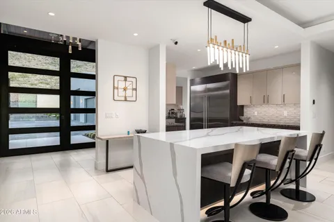 a kitchen that has a stove and a sink