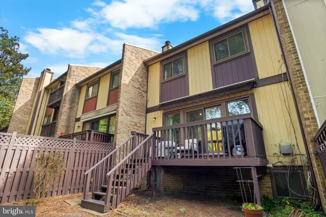 a view of balcony with chair and glass door
