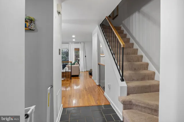 a kitchen with stainless steel appliances granite countertop a stove and a microwave