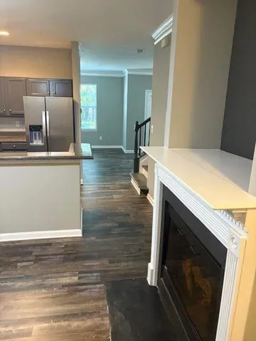 a kitchen with granite countertop a sink and a stove top oven