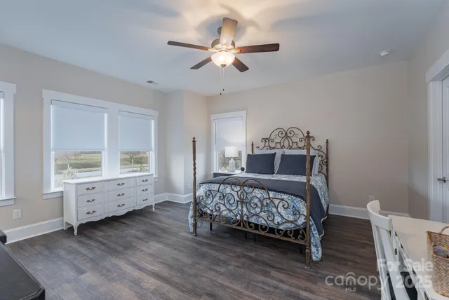 a bedroom with a bed and a table