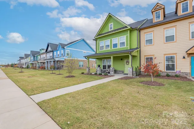 a view of house with outdoor space and swimming pool