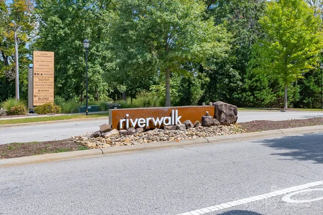an aerial view of a house with a swimming pool a yard and outdoor seating