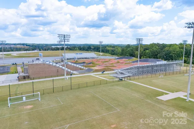 an aerial view of a house with a lake view