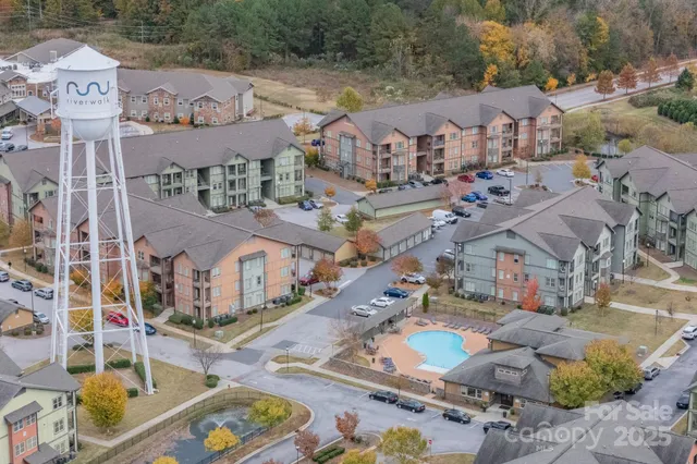an aerial view of residential houses with outdoor space