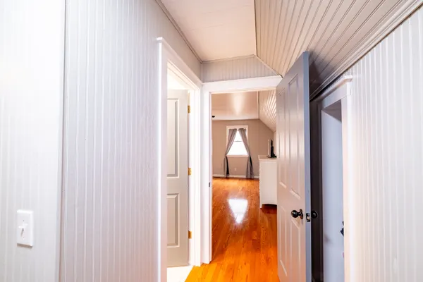 a view of a bathroom from a corridor