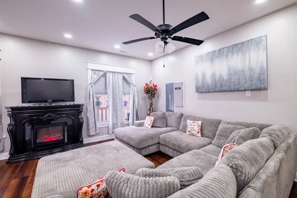 a living room with furniture and a flat screen tv