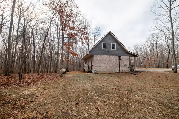a house with trees in the background