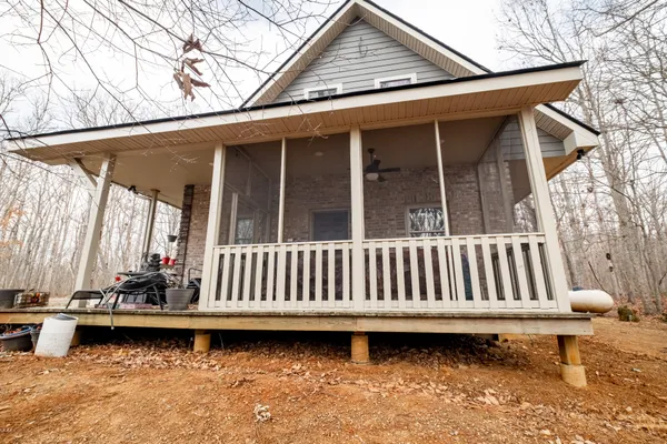 a view of a backyard with a sitting area