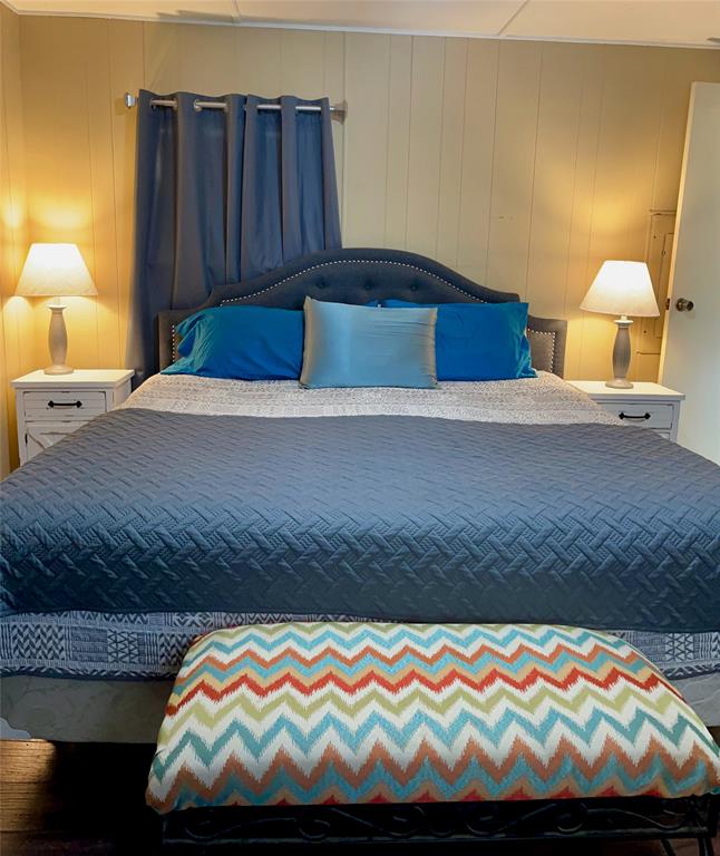 2334 San Bar Road, Unit 50 Graford, TX 76449 - Photo 21 of 40 a bedroom with a bed and lamps