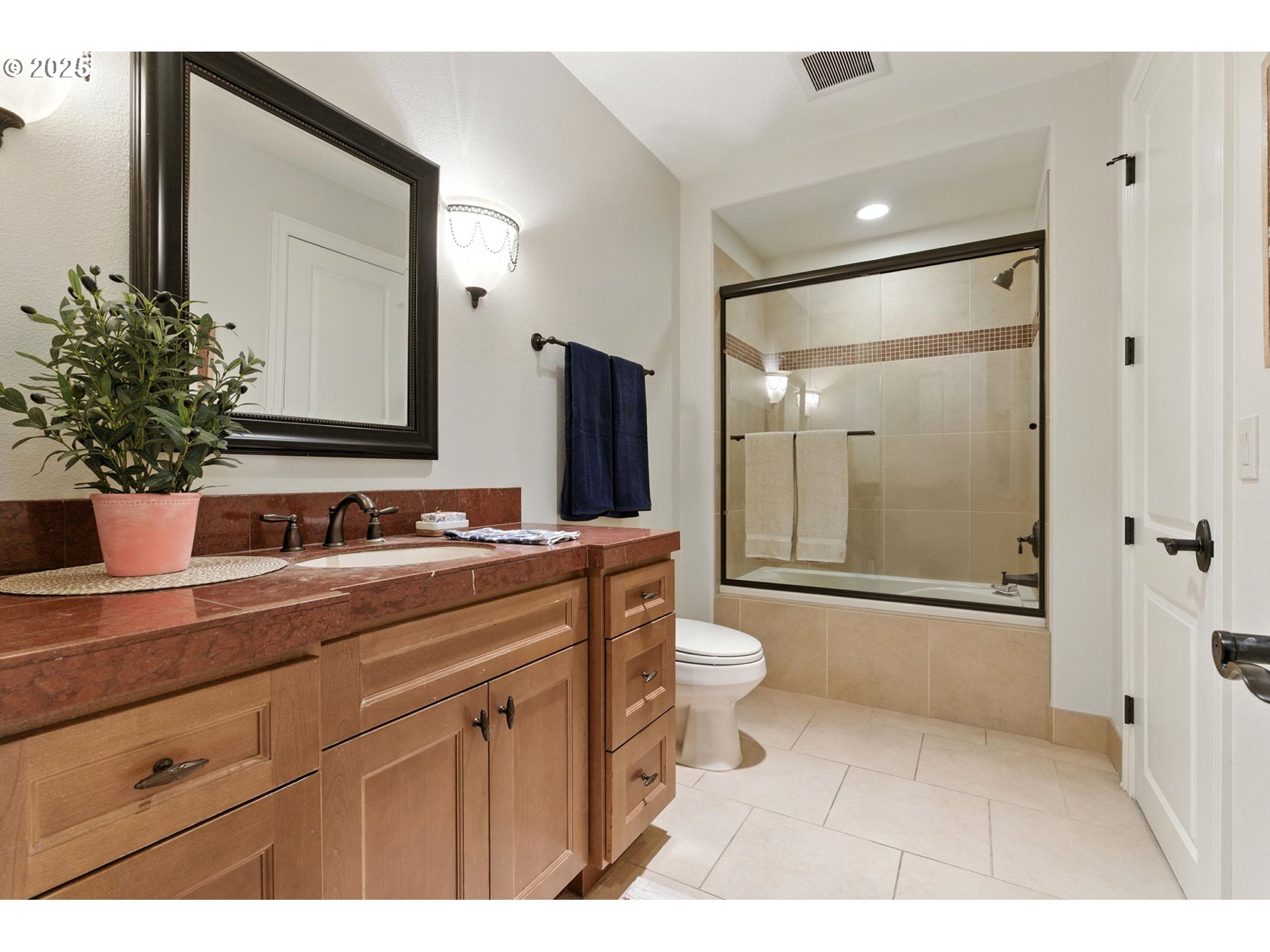784 3rd Street Lake Oswego, OR 97034 - Photo 22 of 48 a bathroom with a shower sink vanity mirror and toilet