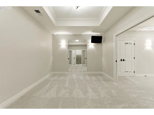 a bathroom with a shower sink and mirror