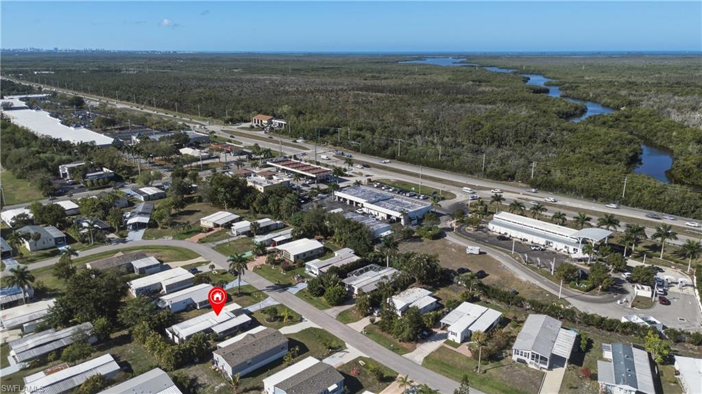 140 Rookery Road Naples, FL 34114 - Photo 14 of 19 Aerial view of property's location featuring a forest and nearby suburban area