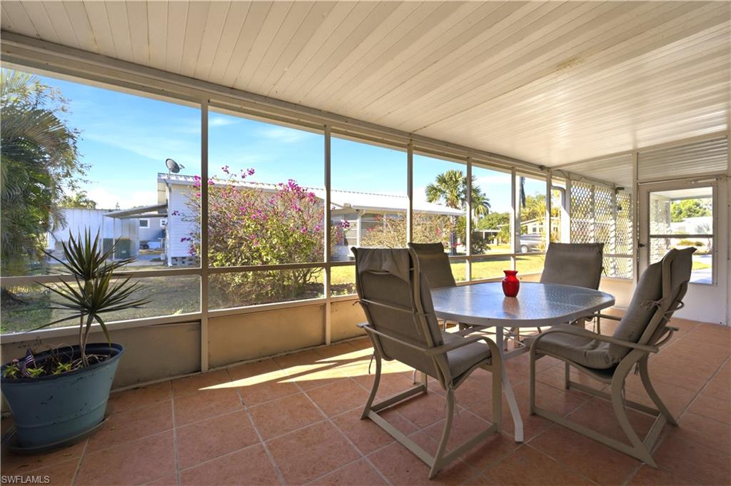 140 Rookery Road Naples, FL 34114 - Photo 4 of 19 Sunroom / solarium with tile patterned floors and wooden ceiling