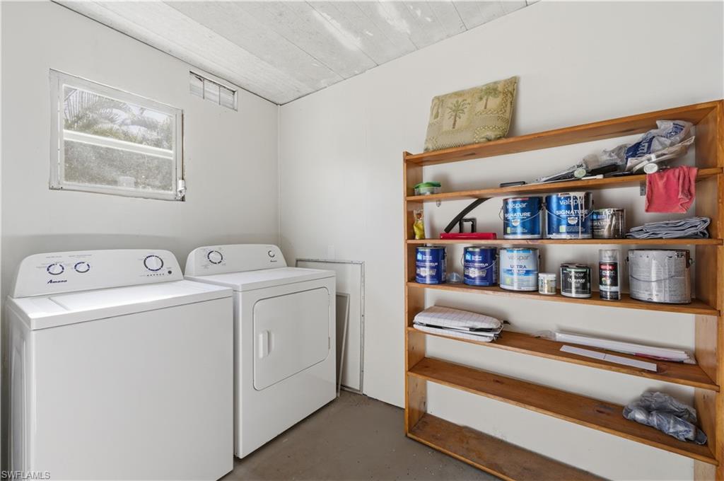 140 Rookery Road Naples, FL 34114 - Photo 5 of 19 Laundry room featuring finished concrete floors and washer and dryer