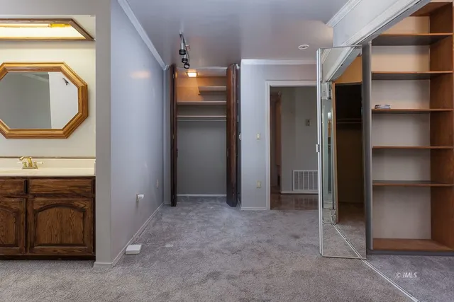 a bathroom with a shower sink and mirror