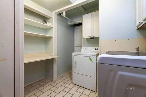 a kitchen with stainless steel appliances a refrigerator sink and cabinets