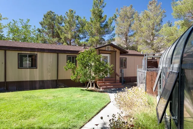 a kitchen with stainless steel appliances a refrigerator sink and cabinets
