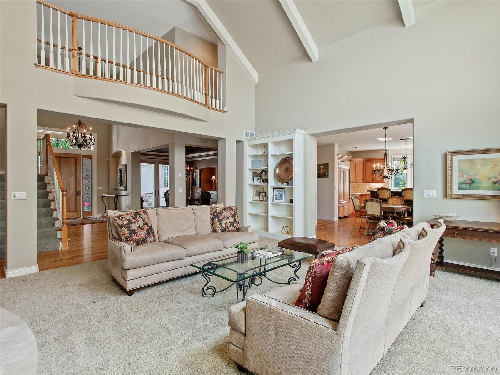984 West Ridge Road Littleton, CO 80120 - Photo 8 of 40 a living room with furniture and a dining table