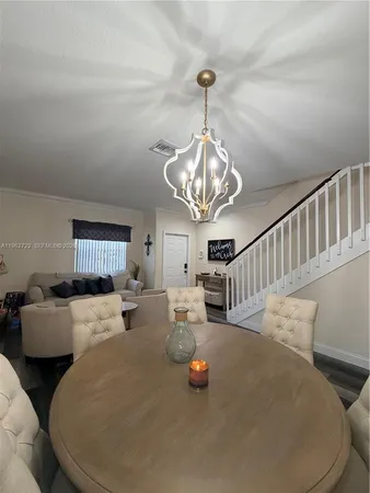 a view of hall way with furniture