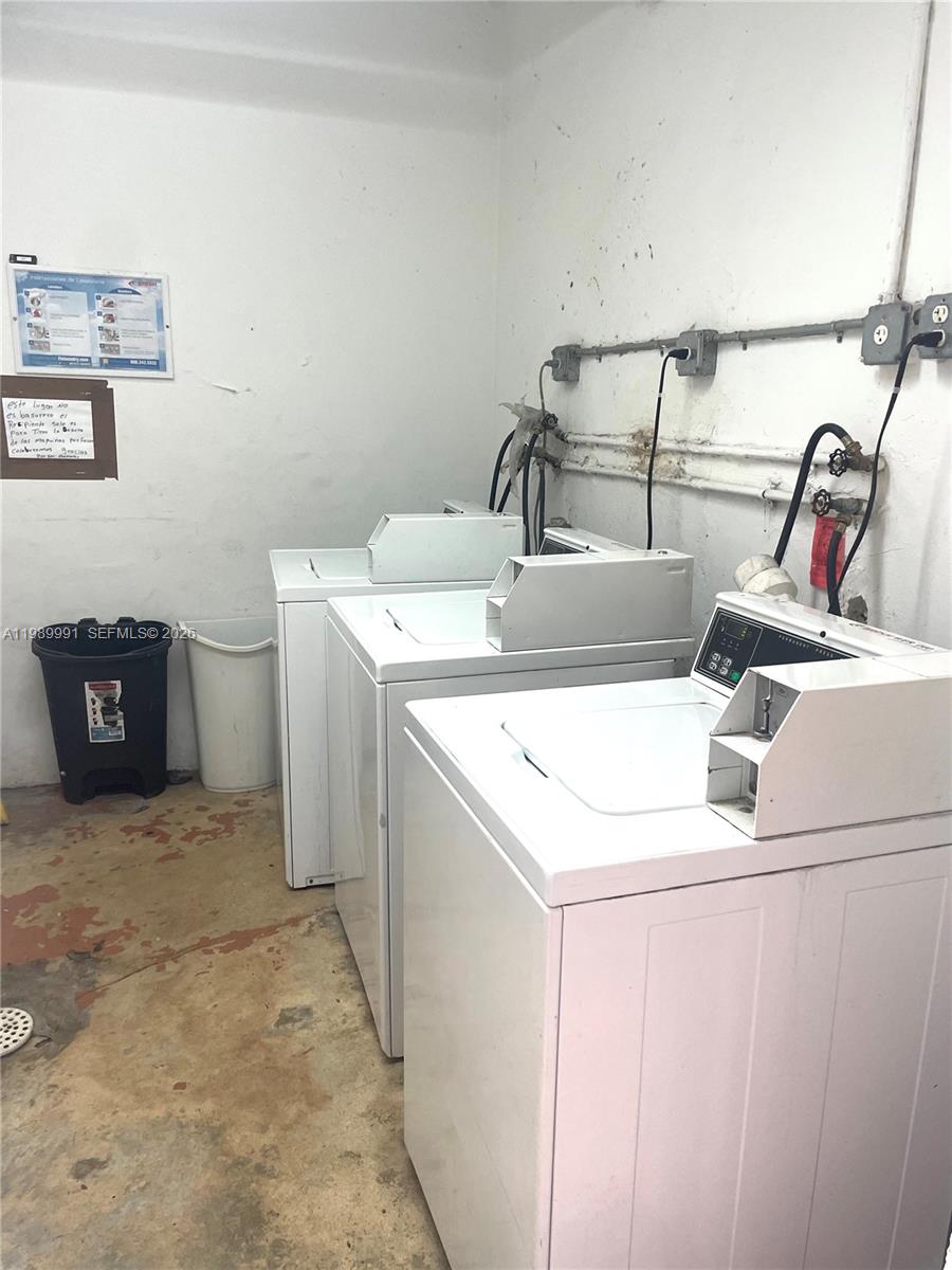 9375 Southwest 40th Terrace, Unit 106 Miami, FL 33165 - Photo 11 of 11 a utility room with dryer and washer