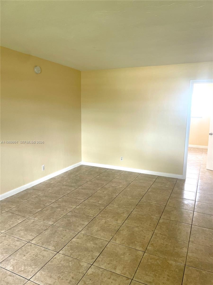 9375 Southwest 40th Terrace, Unit 106 Miami, FL 33165 - Photo 5 of 11 a view of an empty room