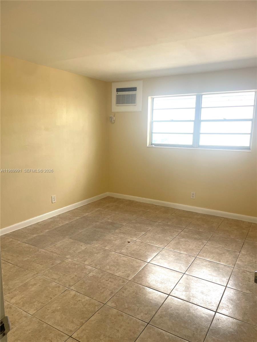 9375 Southwest 40th Terrace, Unit 106 Miami, FL 33165 - Photo 6 of 11 a view of a room with windows