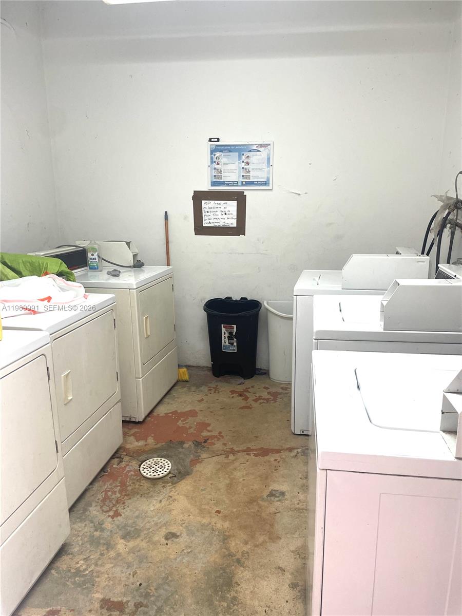 9375 Southwest 40th Terrace, Unit 106 Miami, FL 33165 - Photo 10 of 11 a utility room with dryer and washer