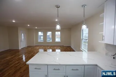 a view of a kitchen has a sink and window in it