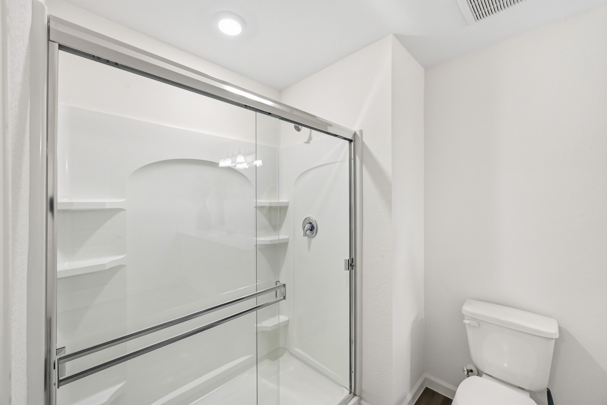 7207 Evitale Way Houston, TX 77049 - Photo 33 of 43 a bathroom with a shower and a toilet