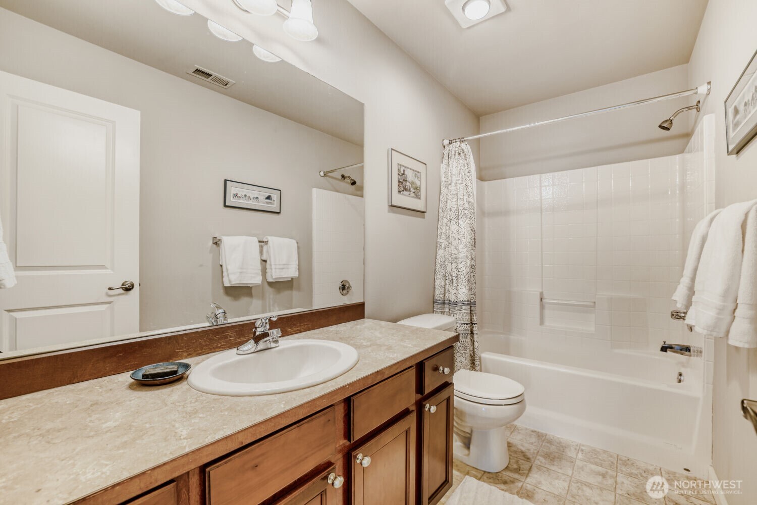 18705 101st Avenue Northeast, Unit 3 Bothell, WA 98011 - Photo 17 of 31 a bathroom with a granite countertop sink toilet and shower