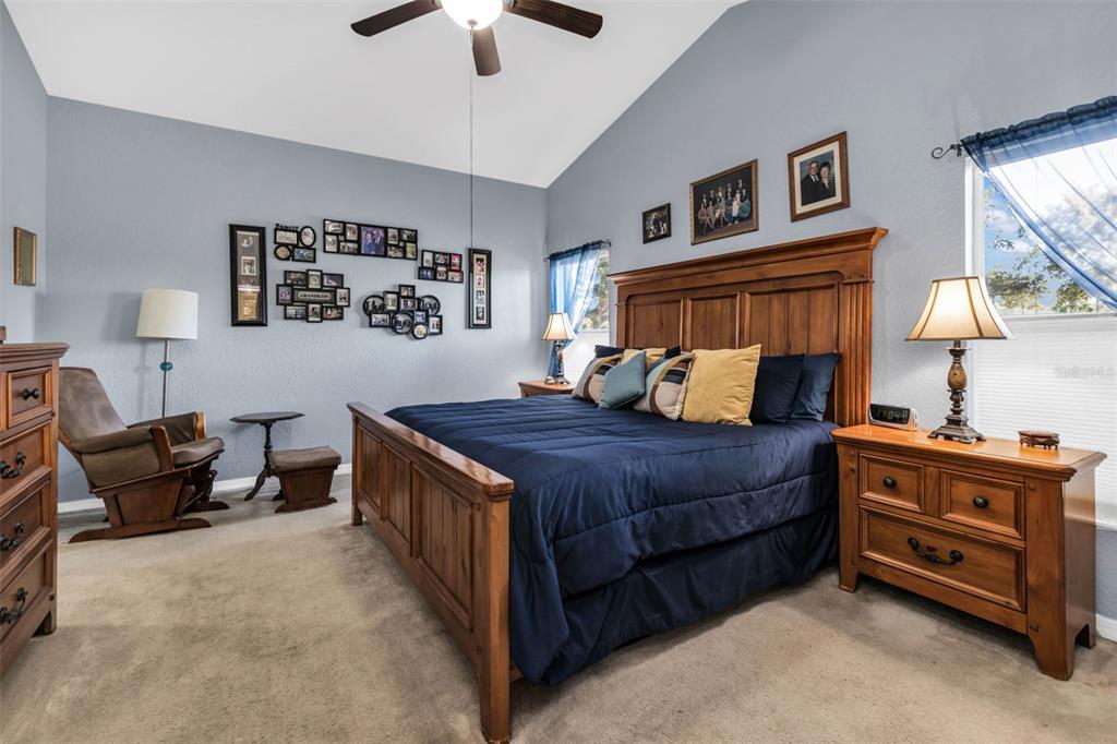 24612 Buckingham Way Punta Gorda, FL 33980 - Photo 14 of 42 a bedroom with a bed and a couch