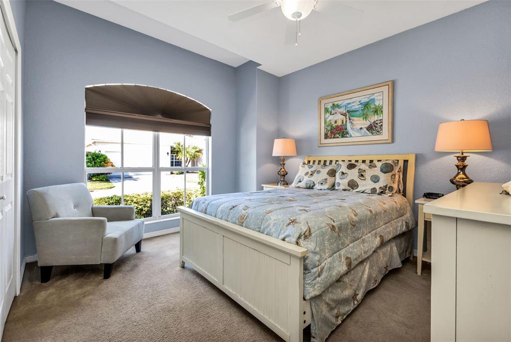 24612 Buckingham Way Punta Gorda, FL 33980 - Photo 17 of 42 a bedroom with a bed and a couch