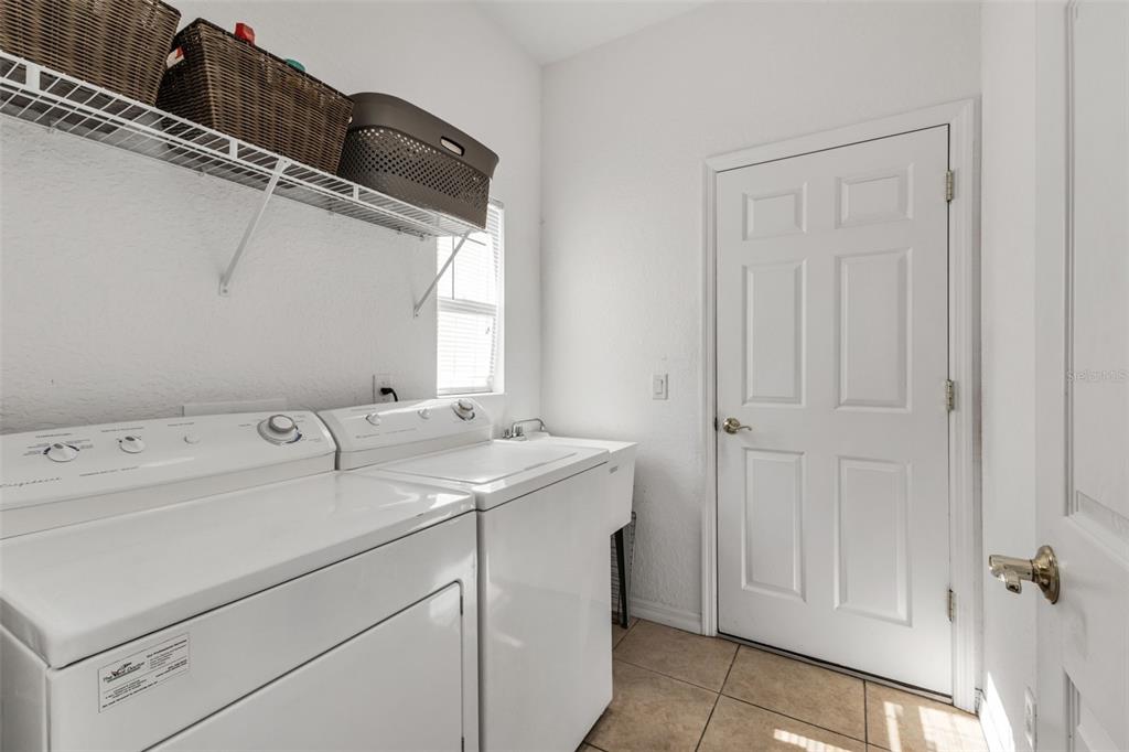 24612 Buckingham Way Punta Gorda, FL 33980 - Photo 19 of 42 a utility room with dryer and washer