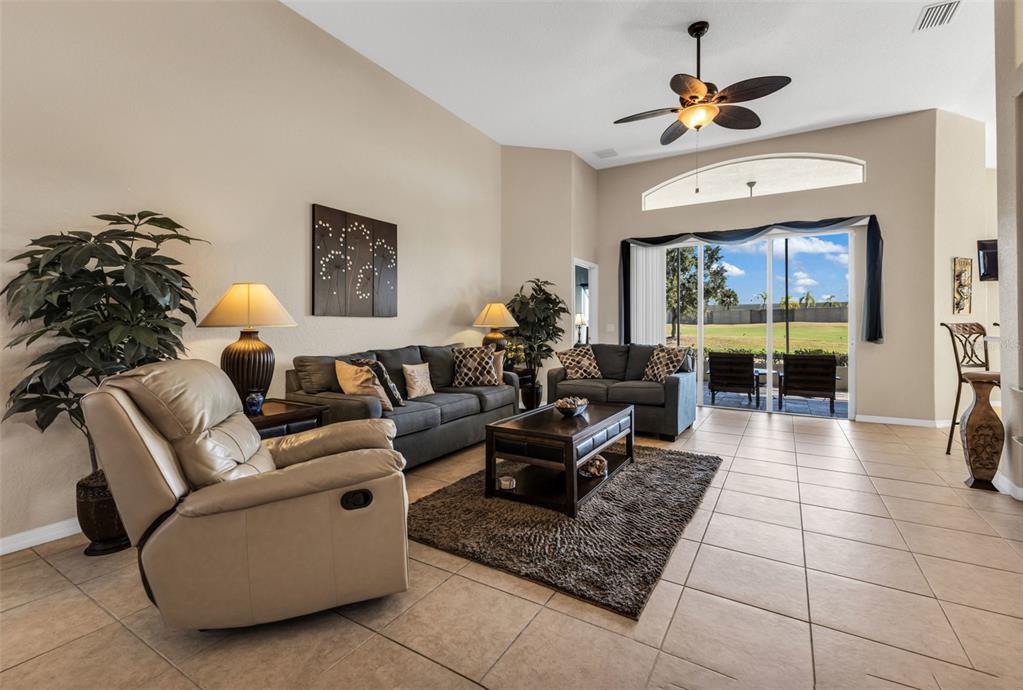 24612 Buckingham Way Punta Gorda, FL 33980 - Photo 5 of 42 a living room with furniture and a large window