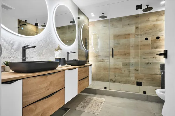 a bathroom with a sink toilet and shower