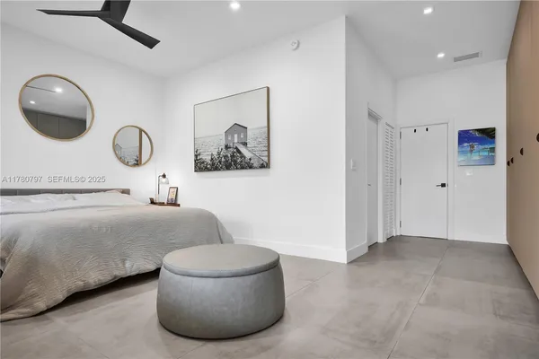 a view of living room with furniture and a potted plant